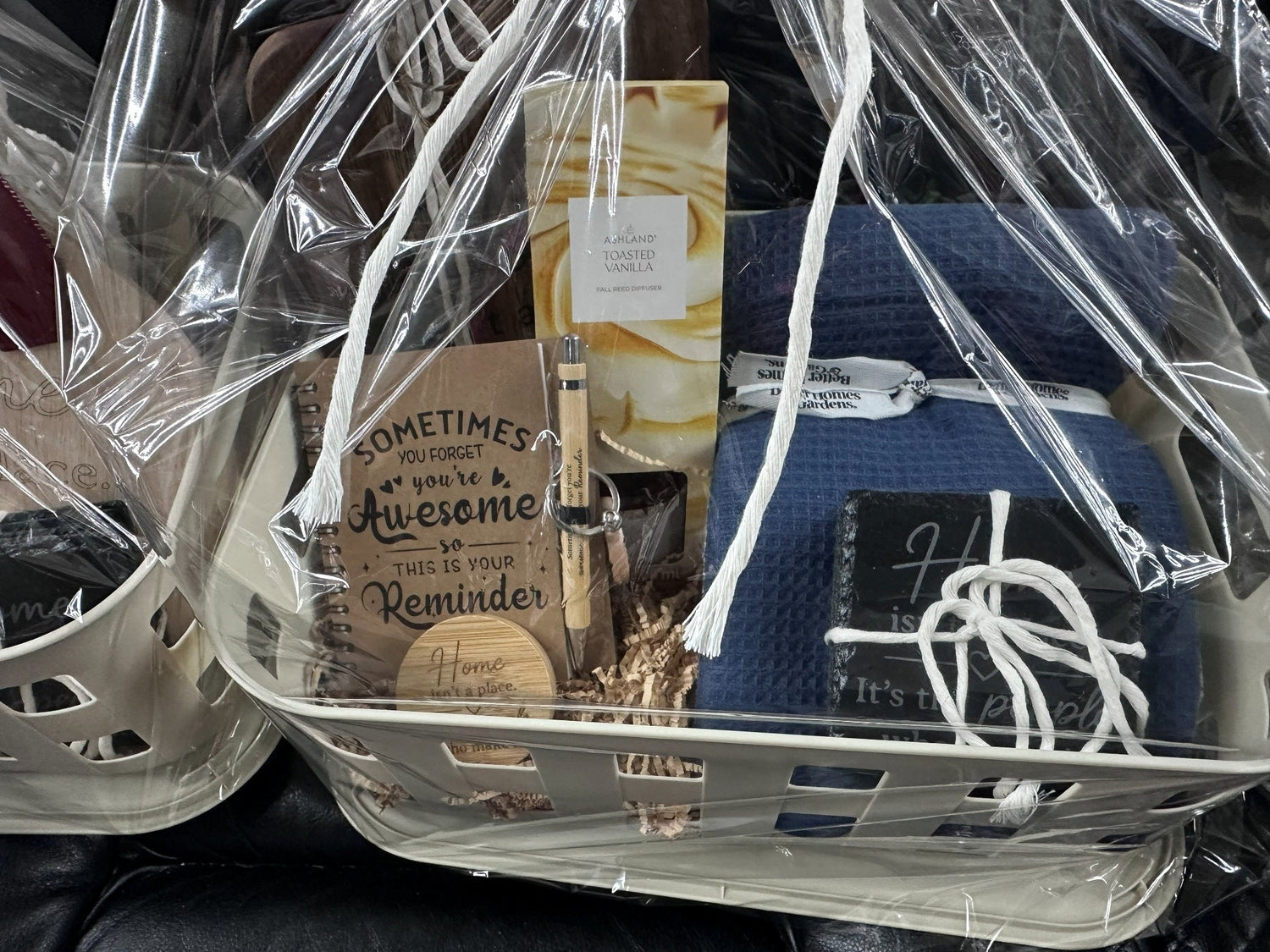 Wrapped personalized closing gift basket with blue blanket