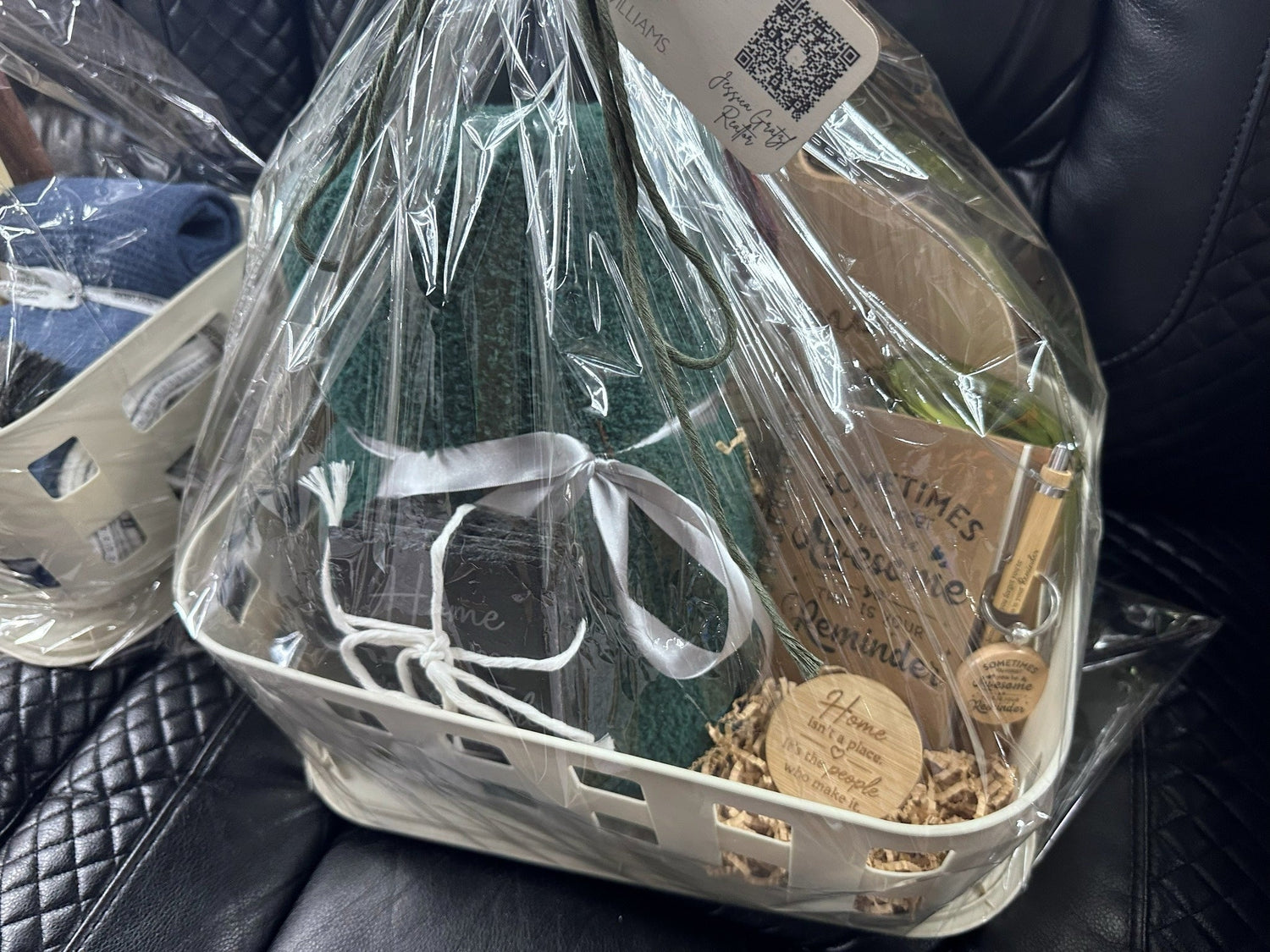Wrapped personalized closing gift basket with green blanket